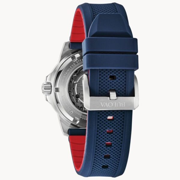 Blue and red watch strap with silver buckle on a watch.