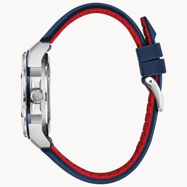 Side view of a stylish watch with a red and navy blue strap.