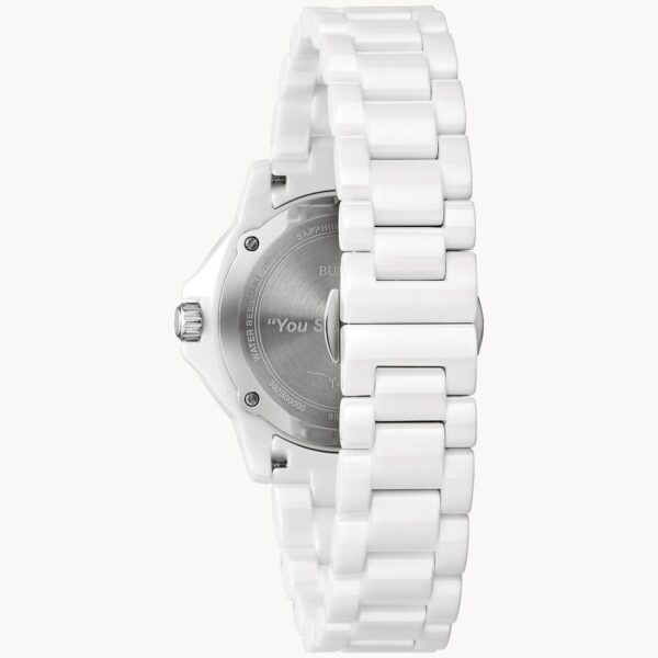 Back view of a white ceramic wristwatch with a metal case back.