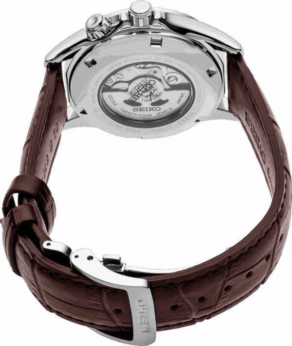 Luxury wristwatch with brown leather strap and visible mechanical movement.