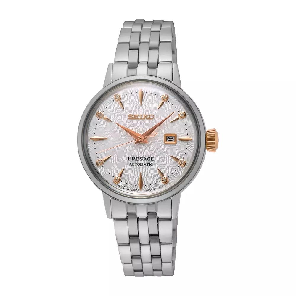 Elegant silver wristwatch with a white dial and rose gold accents.