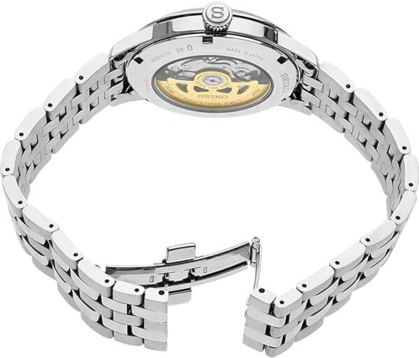 Open stainless steel wristwatch with visible automatic movement.