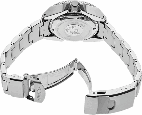 Close-up of a silver wristwatch with an open metal clasp.