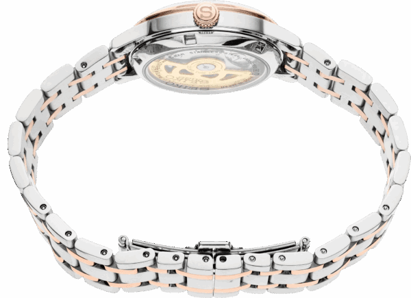 Close-up of a luxury wristwatch with a transparent back and metal bracelet.