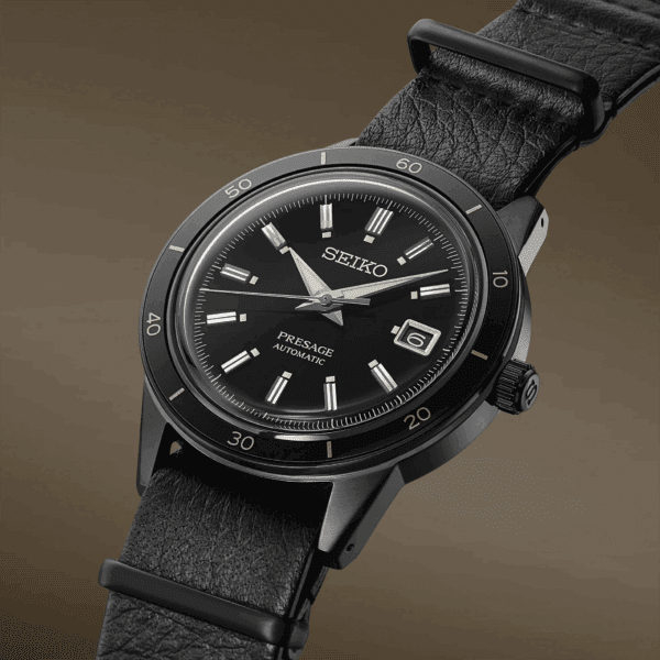 A sleek black Seiko wristwatch with a leather strap.