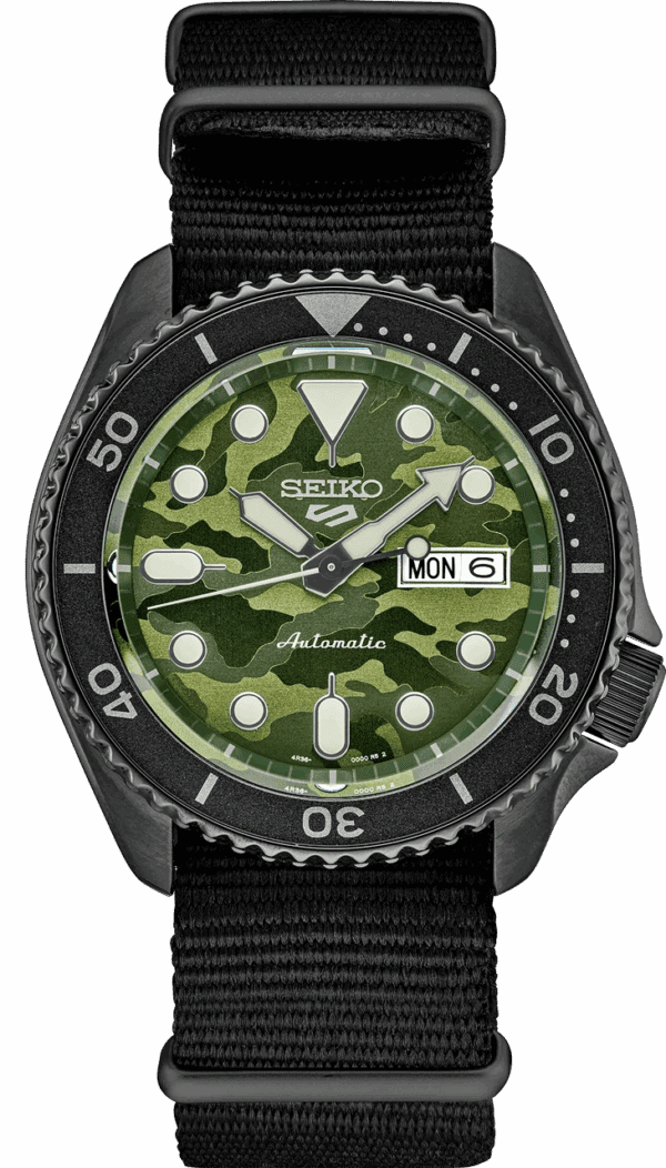 Seiko dive watch with green camouflage dial and black bezel.
