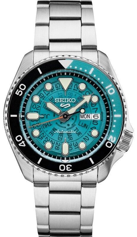 Seiko dive watch with turquoise textured dial and stainless steel bracelet.