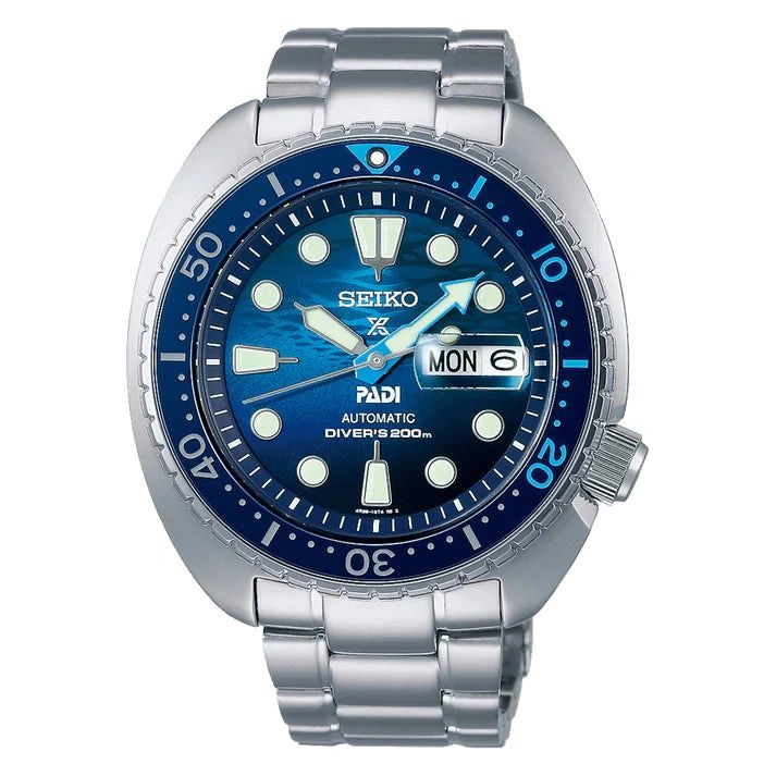 A Seiko dive watch with a stainless steel band and blue dial.