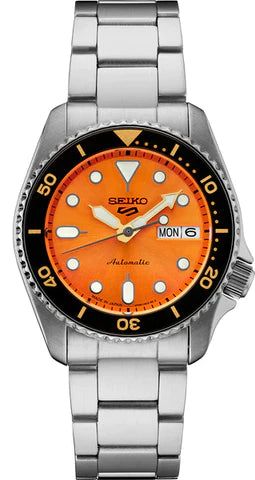 Seiko dive watch with an orange dial and stainless steel bracelet.