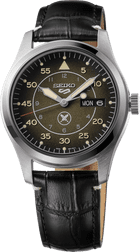 Close-up of a Seiko wristwatch with a black leather strap and olive dial.