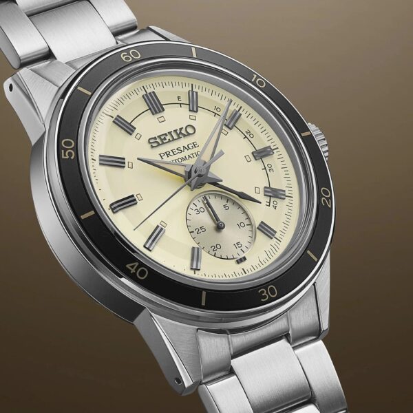 Close-up of a Seiko wristwatch with a cream dial and stainless steel band.