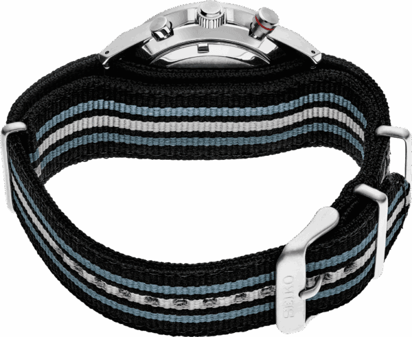 Close-up of a wristwatch with a striped fabric band and silver buckle.