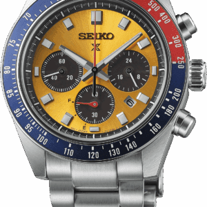 Seiko chronograph watch with yellow dial and blue-red bezel on metal bracelet.