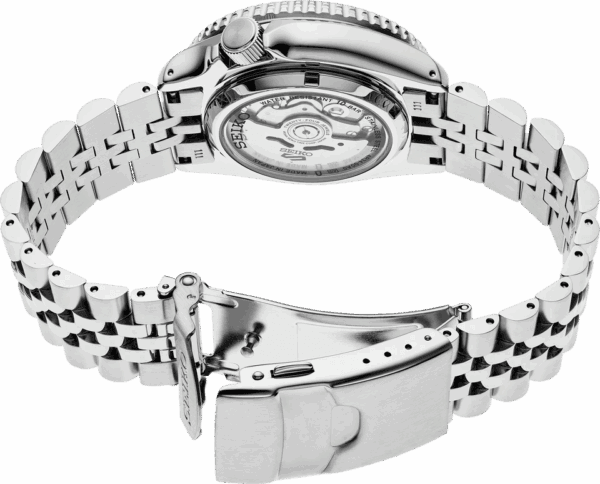 Close-up of a silver metal watch back and bracelet.