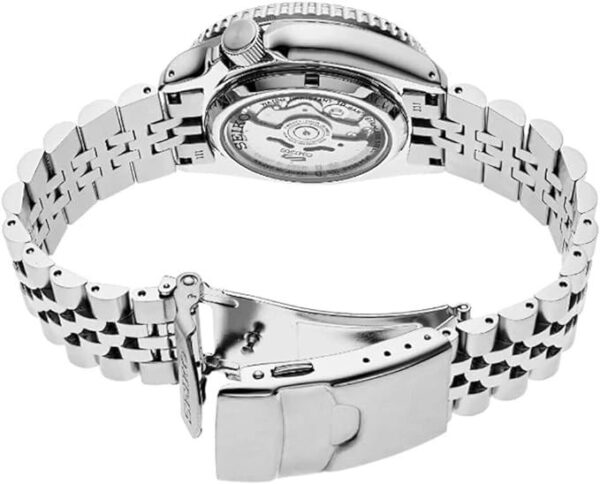 Close-up of a silver wristwatch clasp and bracelet.