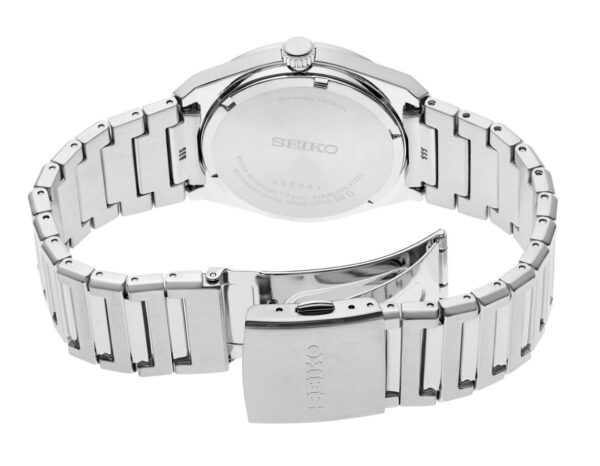 Back view of a silver wristwatch with an open metal bracelet clasp.