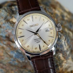 Close-up of a classic Seiko wristwatch with a brown leather strap.
