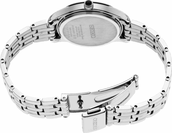 Close-up of a silver wristwatch band and clasp.