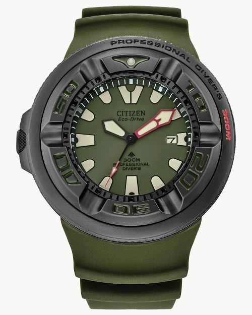 Close-up of a green and black wristwatch with a rugged design.