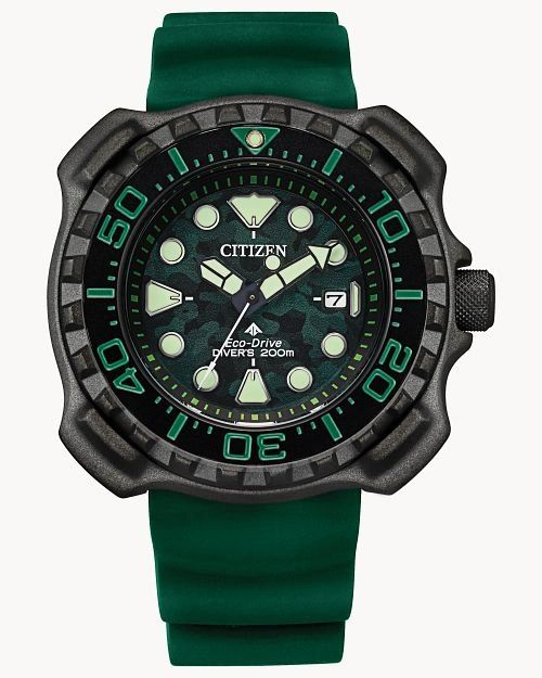 Citizen dive watch with green strap and luminous dial.