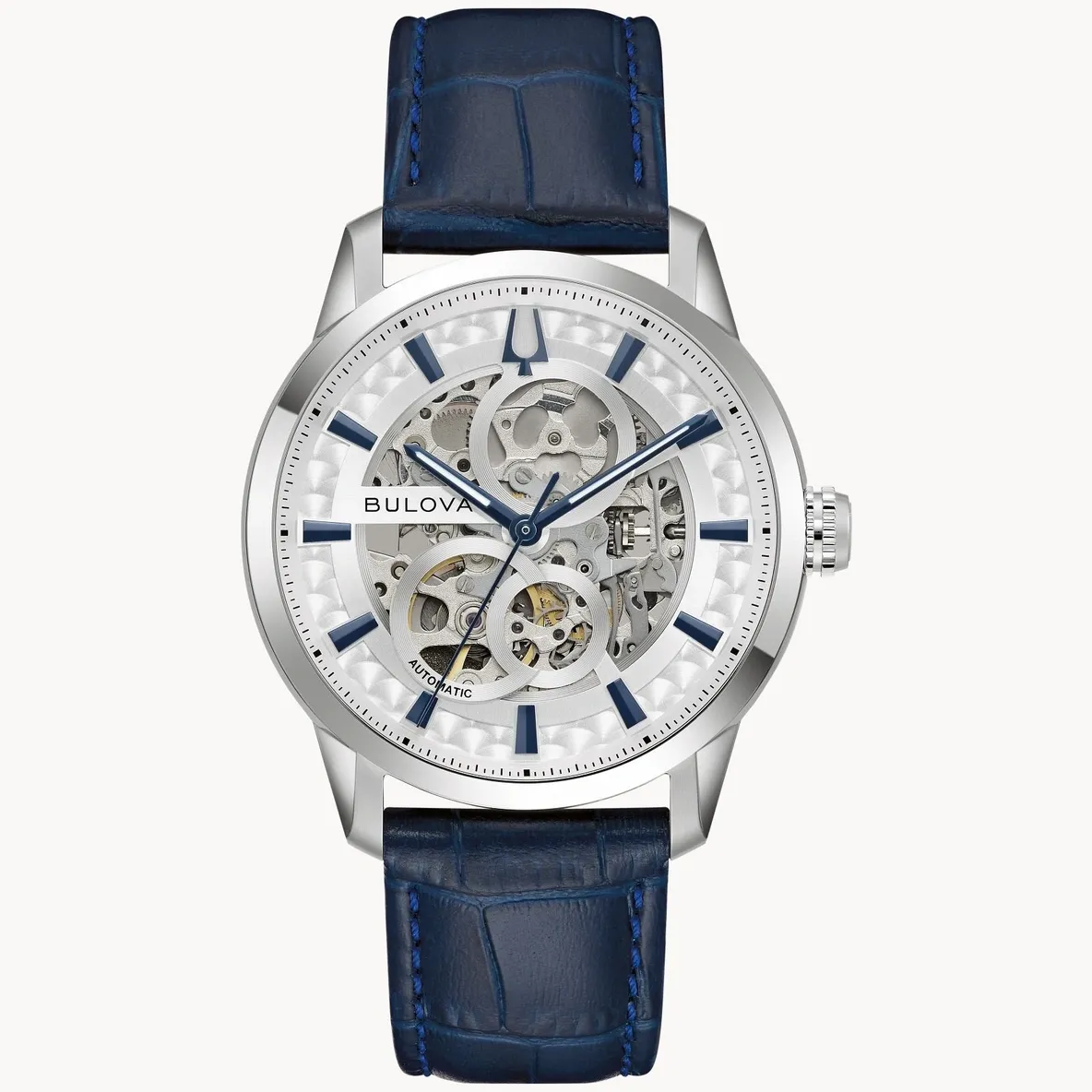 Elegant silver skeleton watch with blue leather strap.