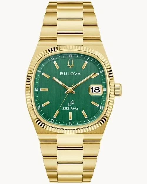 Gold Bulova wristwatch with green dial and date display.