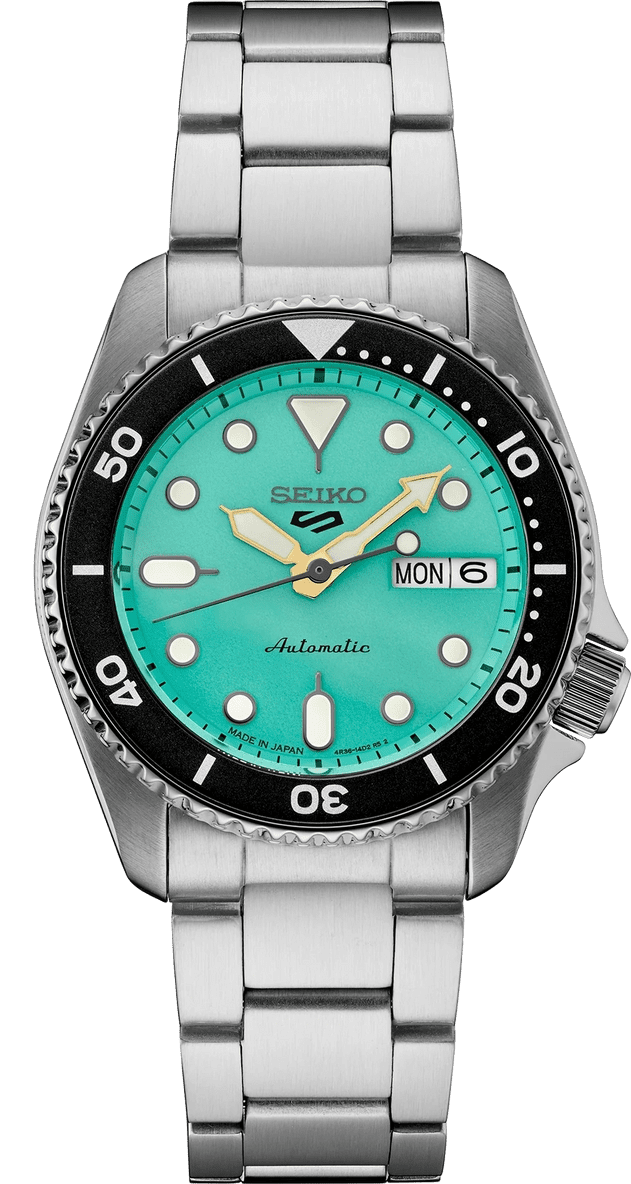 Seiko dive watch with turquoise dial and stainless steel bracelet.