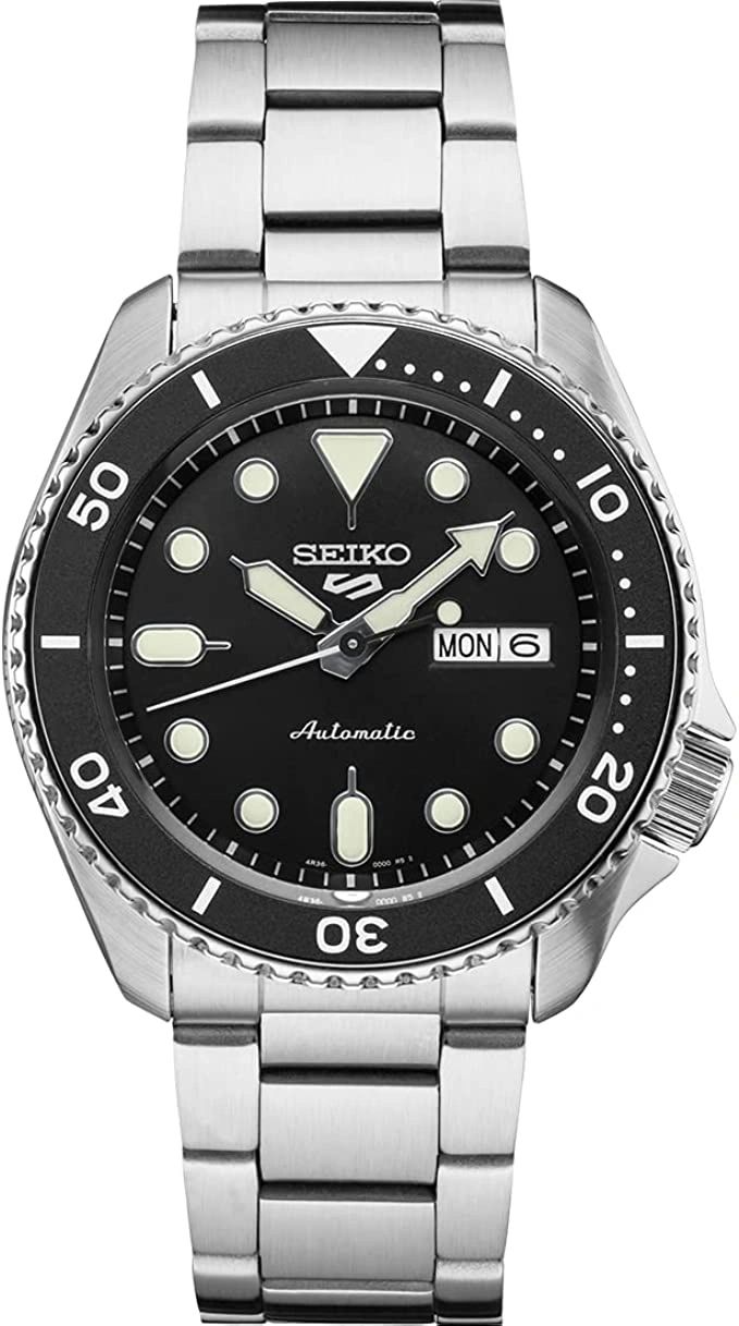Seiko automatic dive watch with black dial and day-date display.